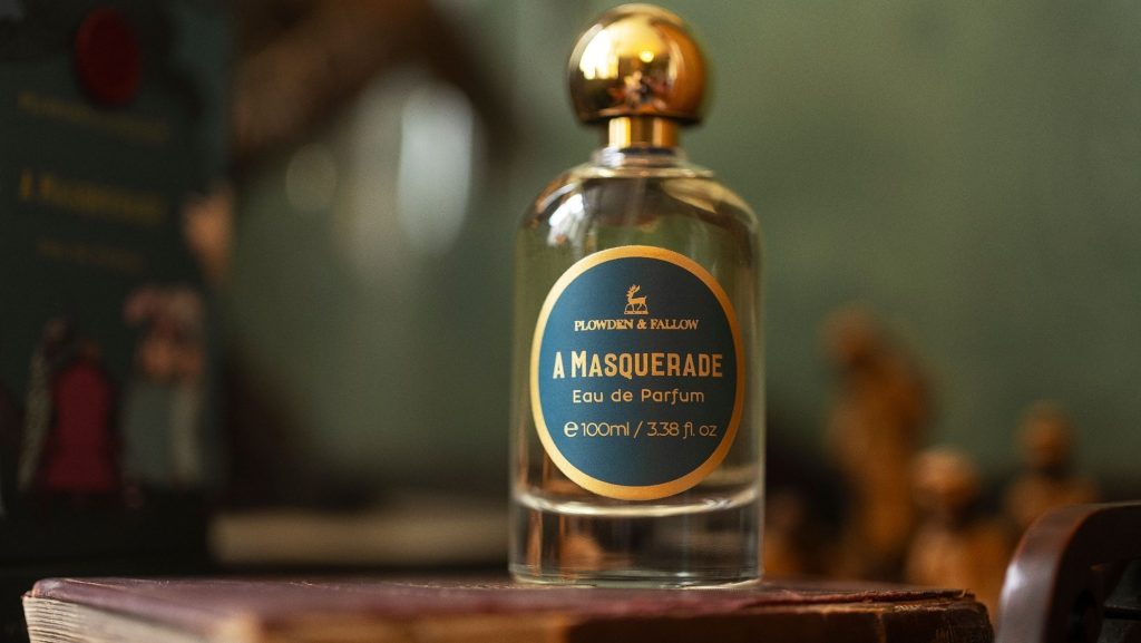 Plowden and Fallow A Masquerade eau de parfum bottle displayed on a book