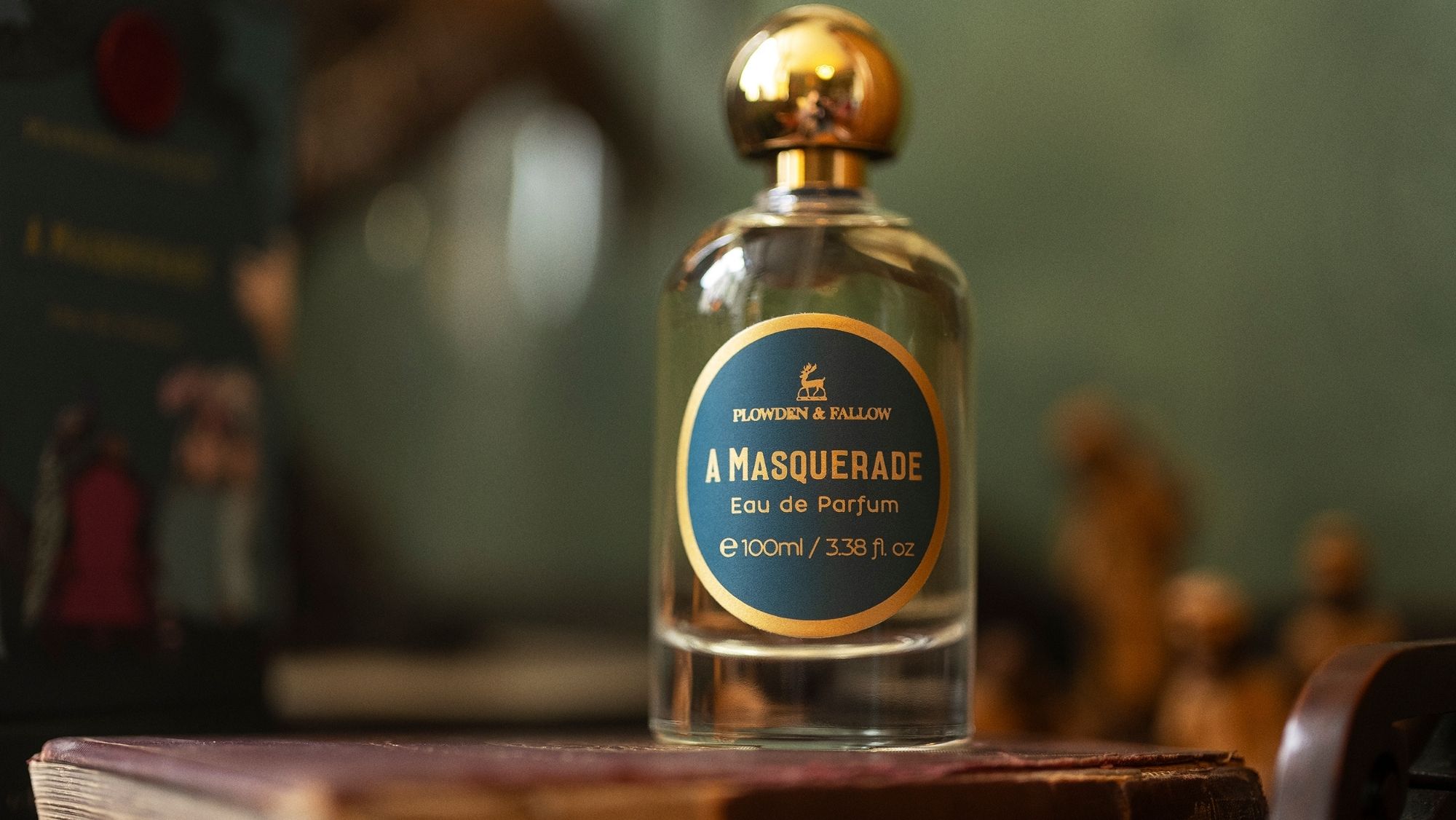 Plowden and Fallow A Masquerade eau de parfum bottle displayed on a book